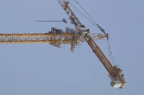 Arm of crane within a construction site — Stockfoto