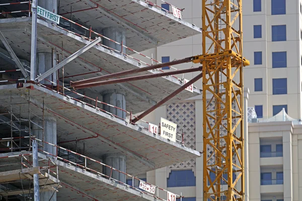 Arm of crane within a construction site — Φωτογραφία Αρχείου