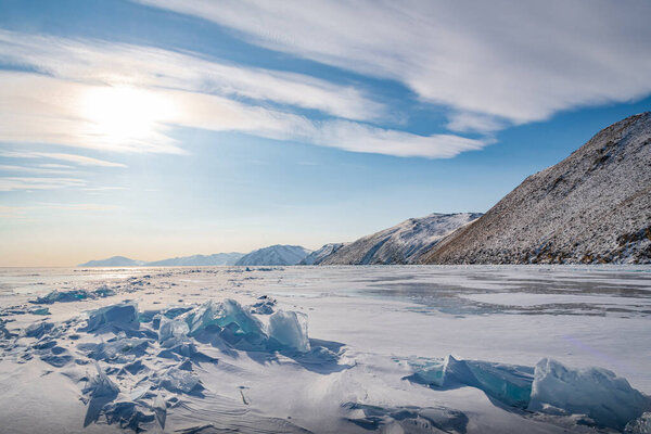 The low evening sun illuminates the chaotic hummocks near the shores of Lake Baikal.