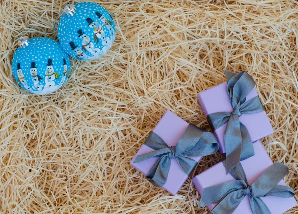Christmas gift boxes with Christmas balls — Stock Photo, Image
