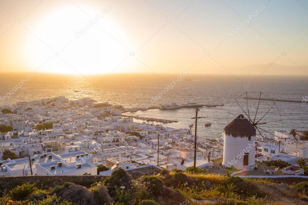 Mykonos town with windmill at sunset