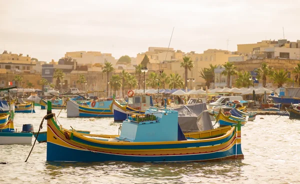 Traditional Luzzu fishing boats at Marsaxlokk Market at morning - Malta Stock Picture