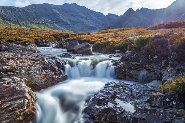 The Fairy Pools and the mountains of Glenbrittle at early morning on Isle of Skye - Scotland, UK