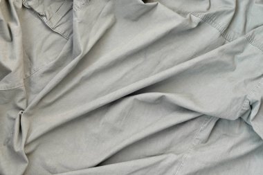 Kumaşın dokusu zeytin renginde, bu da İkinci Dünya Savaşı 'ndaki Amerikan askerlerinin üniformasına benziyor. Askeri tasarım için arkaplan resmi.