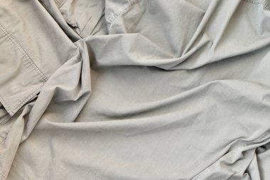 Kumaşın dokusu zeytin renginde, bu da İkinci Dünya Savaşı 'ndaki Amerikan askerlerinin üniformasına benziyor. Askeri tasarım için arkaplan resmi.