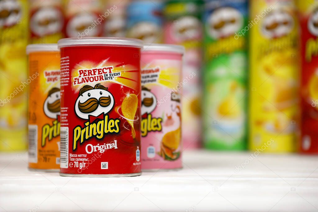 KHARKOV, UKRAINE - NOVEMBER 23, 2020: Pringles variety of flavors. Many cardboard tube cans with Pringles potato chips. Pringles is a brand of potato snack chips owned by the Kellogg Company