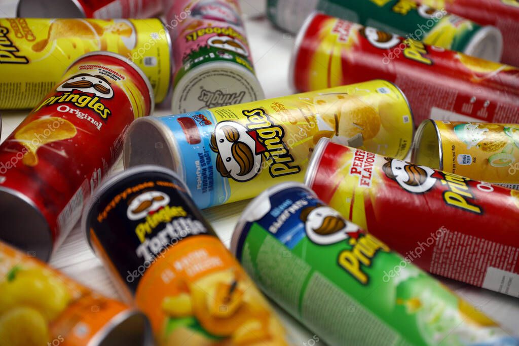 KHARKOV, UKRAINE - NOVEMBER 23, 2020: Pringles variety of flavors. Many cardboard tube cans with Pringles potato chips. Pringles is a brand of potato snack chips owned by the Kellogg Company
