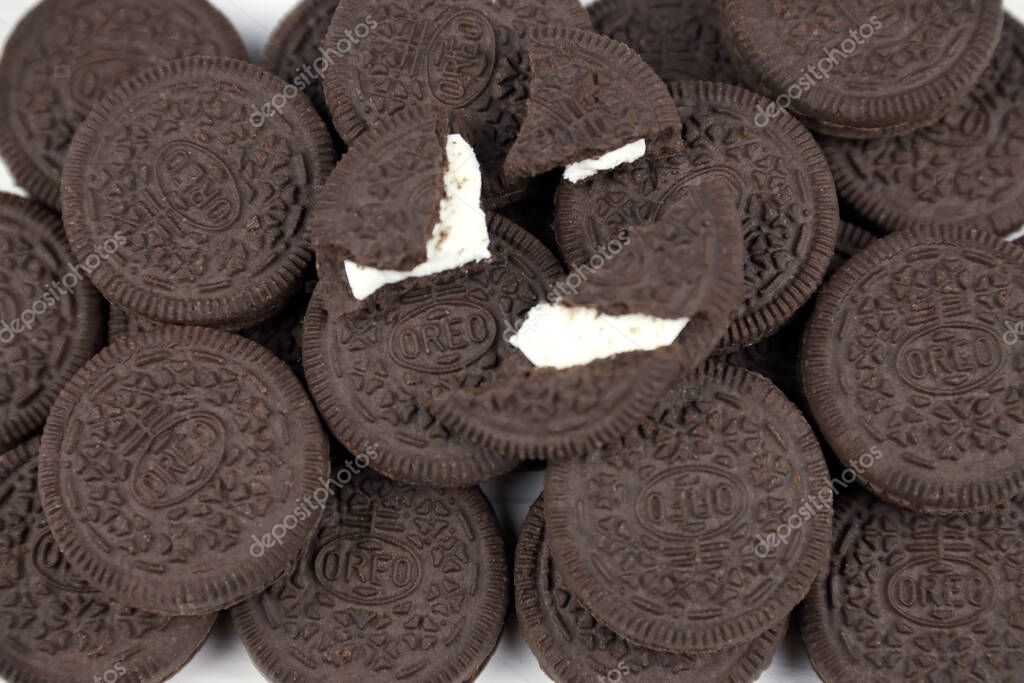 KHARKOV, UKRAINE - NOVEMBER 24, 2020: Oreo sandwich cookies on white table. Oreo is a sandwich cookie with a sweet cream is the best selling cookie in the US