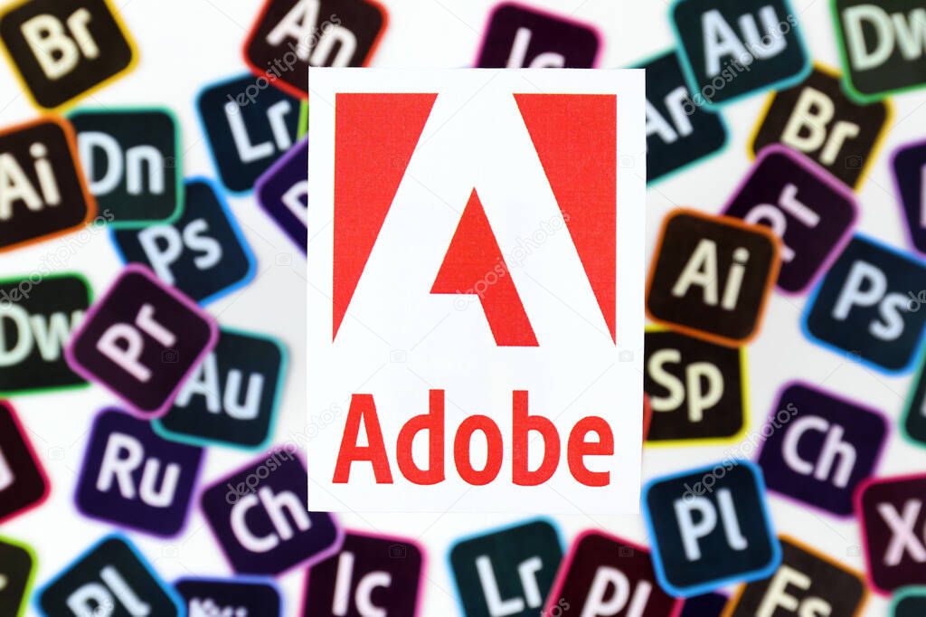 KHARKOV, UKRAINE - DECEMBER 26, 2020: Paper logos of most popular adobe products on white background. Photoshop illustrator bridge indesign premierepro aftereffects lightroom flashbuilder and others
