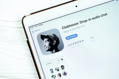 KHARKOV, UKRAINE - FEBRUARY 14, 2021: Clubhouse app in app store market on ipad display screen. Clubhouse is invitation only audio chat iPhone app launched in April 2020