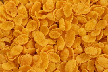 Mısır gevreği dokusu yakından geliyor. Sabah kahvaltısı için mısır gevreği kutusu.