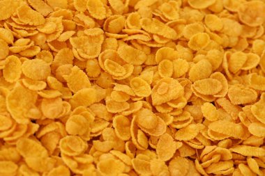 Mısır gevreği arkaplanı ve dokuyu kapatır. Sabah kahvaltısı için mısır gevreği kutusu.