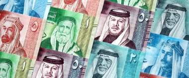 Jordanian Dinar currency money bills. JOD currency banknotes in big amount with different denomination close up