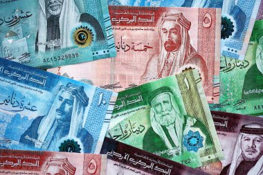 Jordanian Dinar currency money bills. JOD currency banknotes in stack with different denomination close up