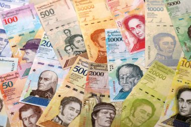 Venezuelan Bolivar currency money bills in big amount. Pile of VED currency banknotes with different denomination close up