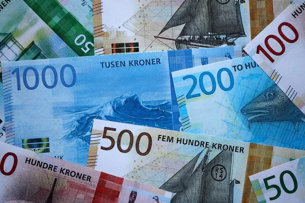 Norwegian Krone currency money bills. NOK currency banknotes in stack with different denomination close up