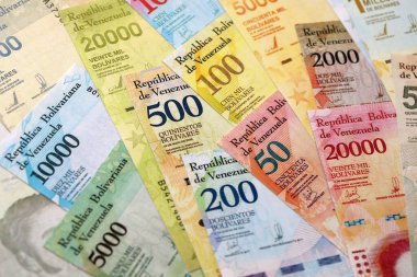 Venezuelan Bolivar currency money bills in stack. VED currency banknotes with different denomination close up