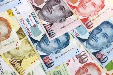 Singapore Dollar currency money bills. SGD currency banknotes in bunch with different denomination close up