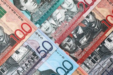 Dominican Republic Pesos currency money bills. DOP currency banknotes in big amount with different denomination close up