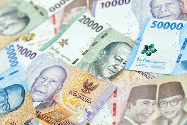 KYIV, UKRAINE - 27 Ocak 2024 Birçok Endonezya rupia para serisinin arkaplan resmi
