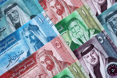 Jordanian Dinar currency money bills. JOD currency banknotes in stack with different denomination close up