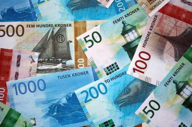 Norwegian Krone currency money bills. NOK currency banknotes in stack with different denomination close up