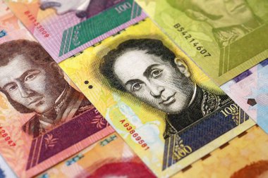 Venezuelan Bolivar currency money bills in big amount. VED currency banknotes with different denomination close up