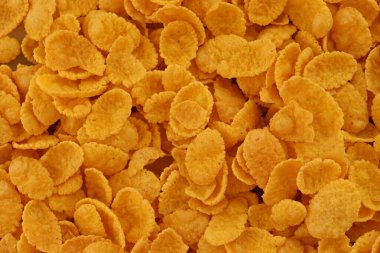 Mısır gevreği arkaplanı ve dokuyu kapatır. Sabah kahvaltısı için mısır gevreği kutusu.