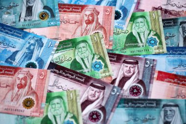 Jordanian Dinar currency money bills. JOD currency banknotes in stack with different denomination close up
