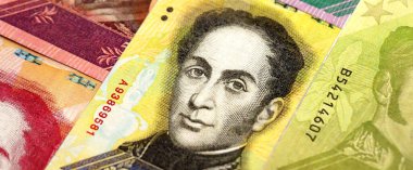 Venezuelan Bolivar currency money bills in big amount. Stack of VED currency banknotes with different denomination close up