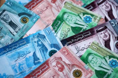 Jordanian Dinar currency money bills. JOD currency banknotes in stack with different denomination close up