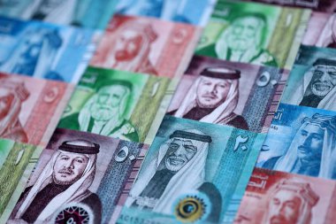 Jordanian Dinar currency money bills. JOD currency banknotes in stack with different denomination close up