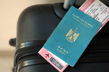 Egyptian passport and avia tickets on travel bag close up. The concept of travel and vacation