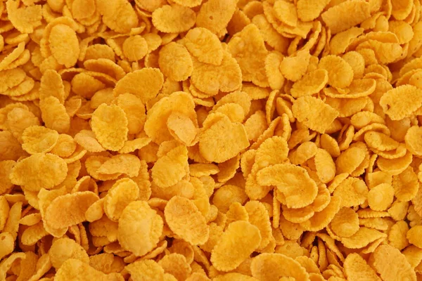 Mısır gevreği dokusu yakından geliyor. Sabah kahvaltısı için mısır gevreği kutusu.