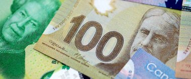 Canadian Dollar currency money bills. CAD currency banknotes in big bunch with different denomination close up