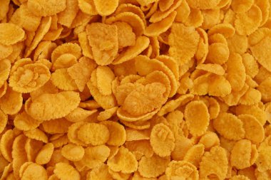 Mısır gevreği arkaplanı ve dokuyu kapatır. Sabah kahvaltısı için mısır gevreği kutusu.