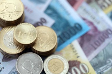 Pile of Hungarian Forint currency money bills and coins. HUF currency banknotes and coins close up