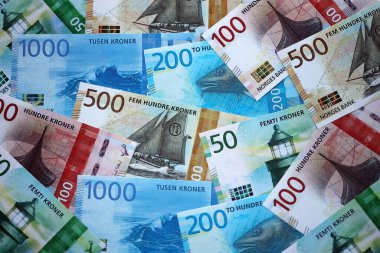 Norwegian Krone currency money bills. NOK currency banknotes in stack with different denomination close up