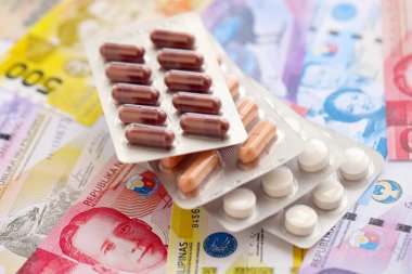 Filipinler para birimi faturaları ve ilaç hapları kapanıyor. İlaç ve eczane kavramı