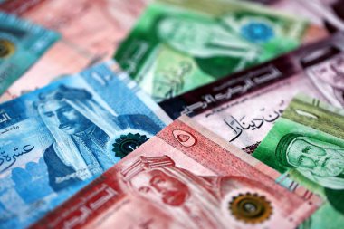 Jordanian Dinar currency money bills. JOD currency banknotes in big amount with different denomination close up