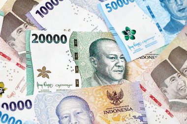 KYIV, UKRAINE - 27 Ocak 2024 Birçok Endonezya rupia para serisinin arkaplan resmi