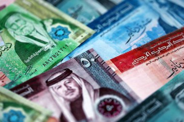 Jordanian Dinar currency money bills. JOD currency banknotes in big amount with different denomination close up
