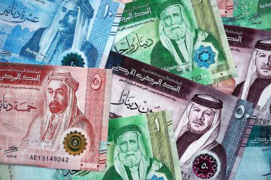 Jordanian Dinar currency money bills. JOD currency banknotes in big amount with different denomination close up