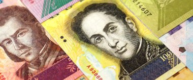 Venezuelan Bolivar currency money bills in big amount. VED currency banknotes with different denomination close up