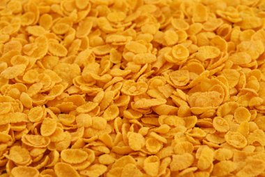 Mısır gevreği arkaplanı ve dokuyu kapatır. Sabah kahvaltısı için mısır gevreği.