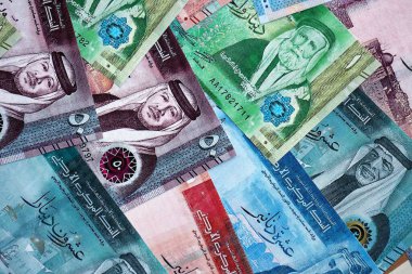 Jordanian Dinar currency money bills. JOD currency banknotes in stack with different denomination close up