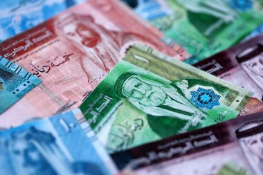 Jordanian Dinar currency money bills. JOD currency banknotes in stack with different denomination close up