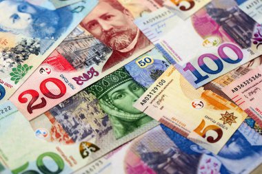 Georgian Lari currency money bills. GEL currency banknotes in pile with different denomination close up