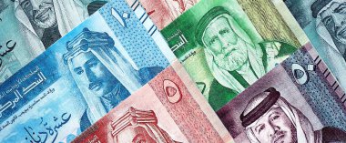 Jordanian Dinar currency money bills. JOD currency banknotes in stack with different denomination close up