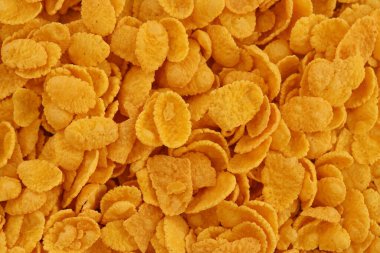 Mısır gevreği arkaplanı ve dokuyu kapatır. Sabah kahvaltısı için mısır gevreği kutusu.